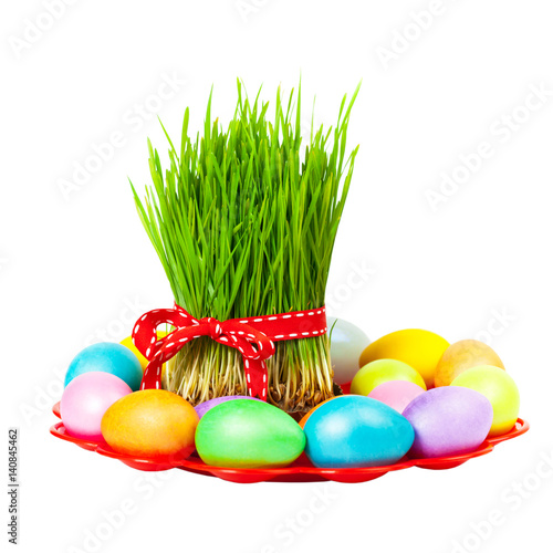 Colored eggs, wheat springs on Nowruz holiday on white background. Selective focus.