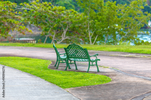 empty metal green benches in the Park