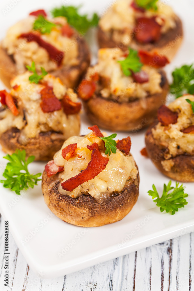 Bacon Stuffed Mushrooms with Breadcrumbs and Cheese. Selective focus. Bacon Stuffed Mushrooms with Breadcrumbs and Cheese. Selective focus.