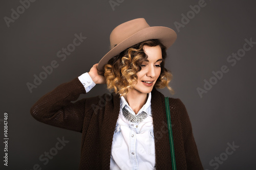 Close up portrait of beautiful woman in hat,bohho style,beauty make up,amazing bohho look,Rings,decorations on the girl,great details,curly hair,denim shirt,red lips,European in hat,Well-groomed skin