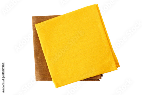 Canvas Print Two colorful napkins, yellow and brown, on white