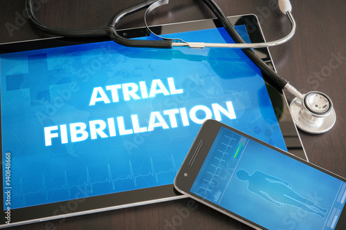 Atrial fibrillation (heart disorder) diagnosis medical concept on tablet screen with stethoscope photo
