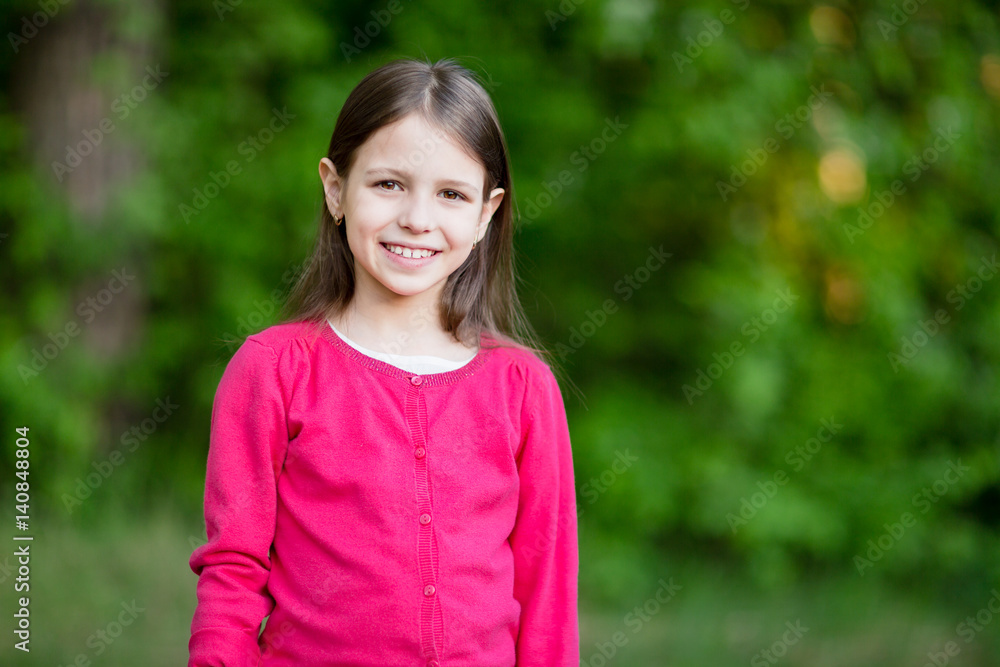 Portrait of cute school girl outside in blooming garden. Portrait of cute school girl outside in blooming garden.