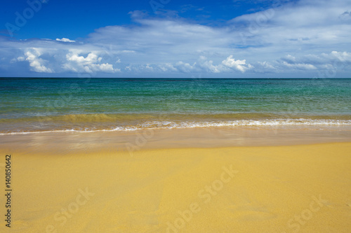 sea surf on the beach. Sand  sea  blue sky and white clouds