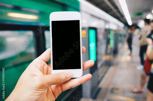 Smartphone black screen in hand at train station