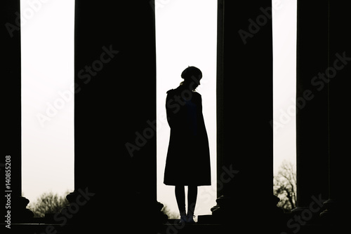 Photography Silhouette of a Young woman in the street.