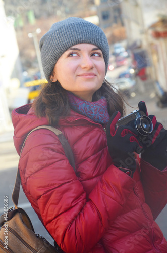A beautiful young woman with a camera