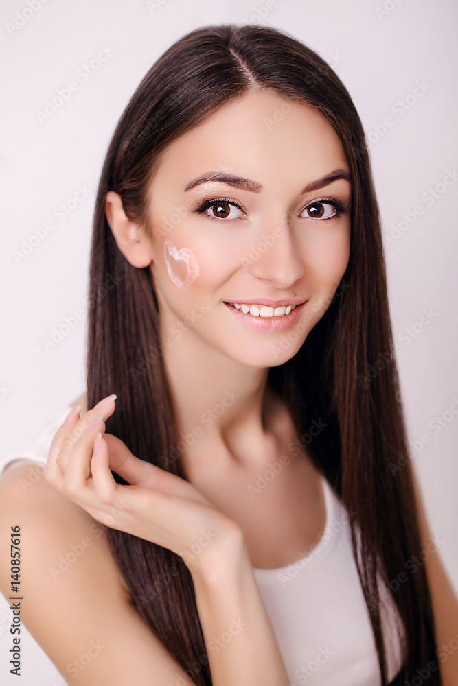 Beautiful Young Woman with Clean Fresh Skin touch her face . Facial treatment . Cosmetology , beauty and spa . Beautiful Young Woman with Clean Fresh Skin touch her face . Facial treatment . Cosmetology , beauty and spa .