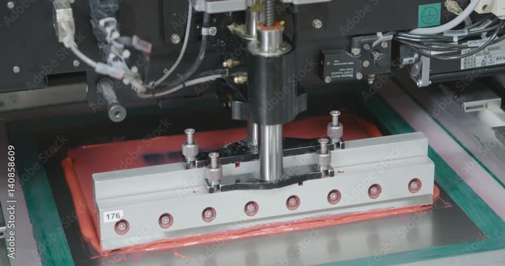 Machine causes the pink sealant on PCB. Closeup Machine causes the pink sealant on PCB. Closeup