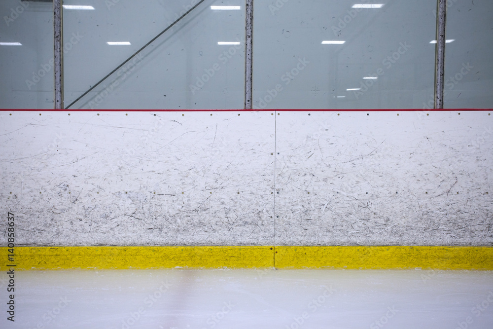 Obraz premium A straight on shot featuring well worn hockey boards in a recreational hockey rink.