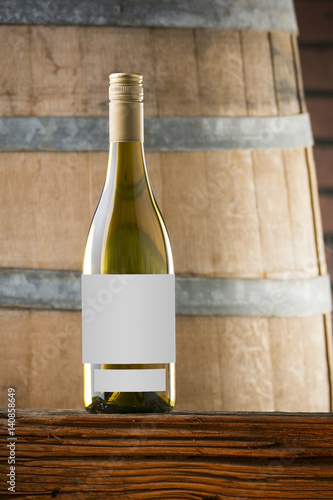 White Wine on Barrel Background with Blank Label © Dale