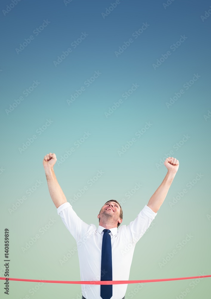 Excited businessman crossing the finish line Excited businessman crossing the finish line