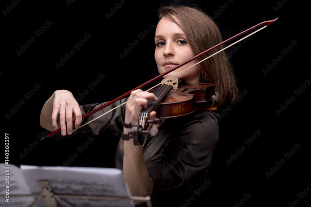 proud violinist woman with her violin and bow