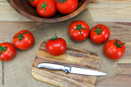 Closeup Fresh ripe tomatoes on wood background