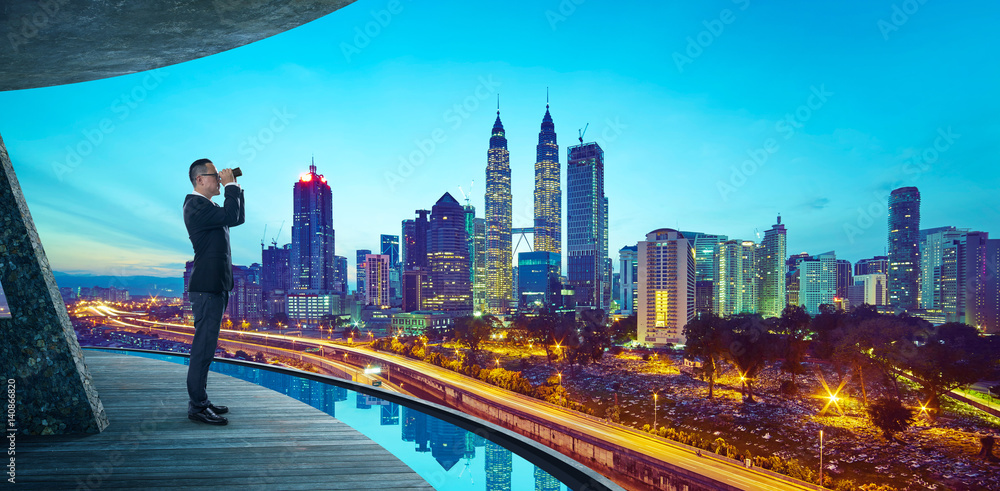 Business Man use the telescope to watch the modern city skyline