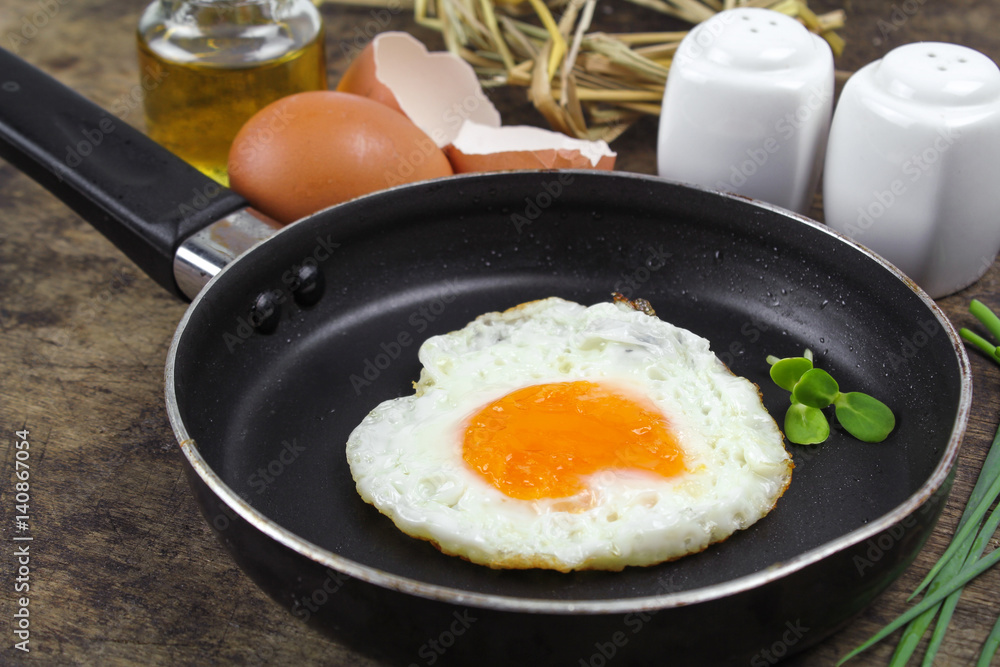 fried egg heart-shaped for breakfast on plate fried egg heart-shaped for breakfast on plate