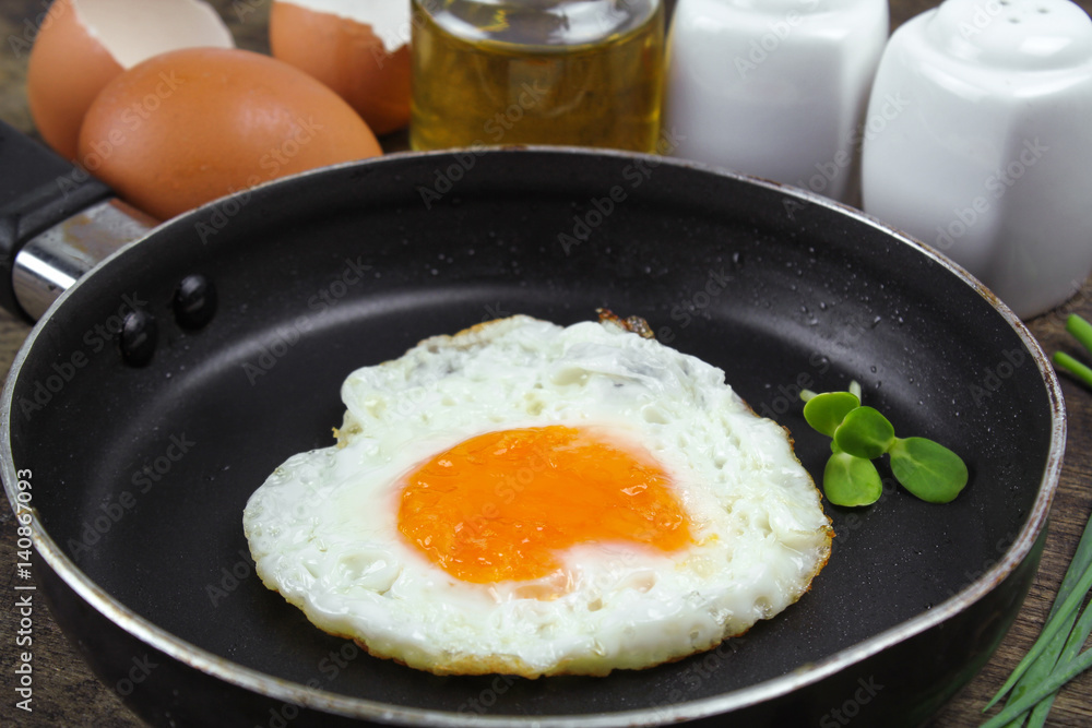 fried egg heart-shaped for breakfast on plate fried egg heart-shaped for breakfast on plate