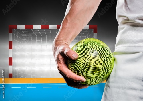 Quadro em tela Close-up of male handball player holding ball against goal post