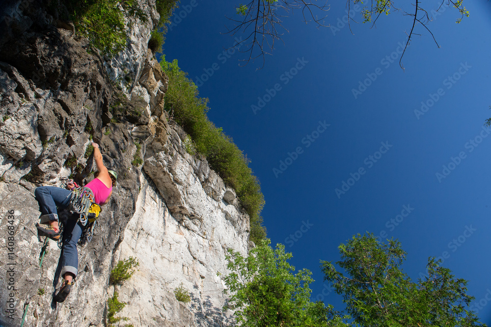 Woman rock climbing on Ontario's Niagara Escarpment in Canada