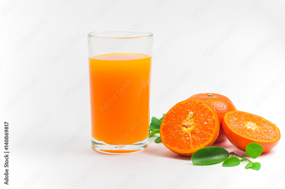 Orange juice pour in a glass and the orange effect placed on the side on white background Orange juice pour in a glass and the orange effect placed on the side on white background