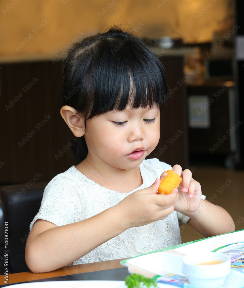 Adorable child girl eating Deep-fried Cheese Stick Adorable child girl eating Deep-fried Cheese Stick