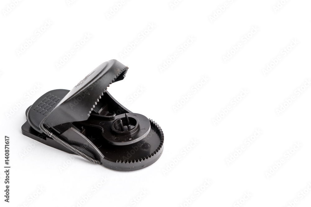 Mousetrap black in plastic and metal on a white background