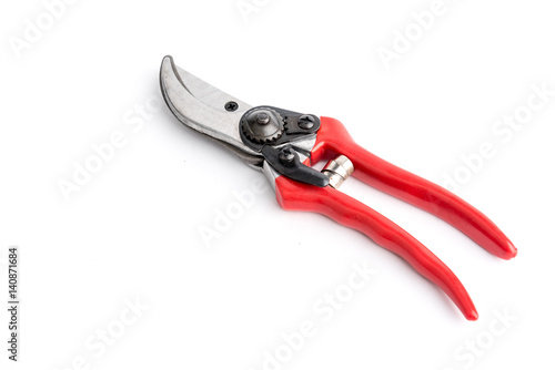 Red garden pruner on the white background