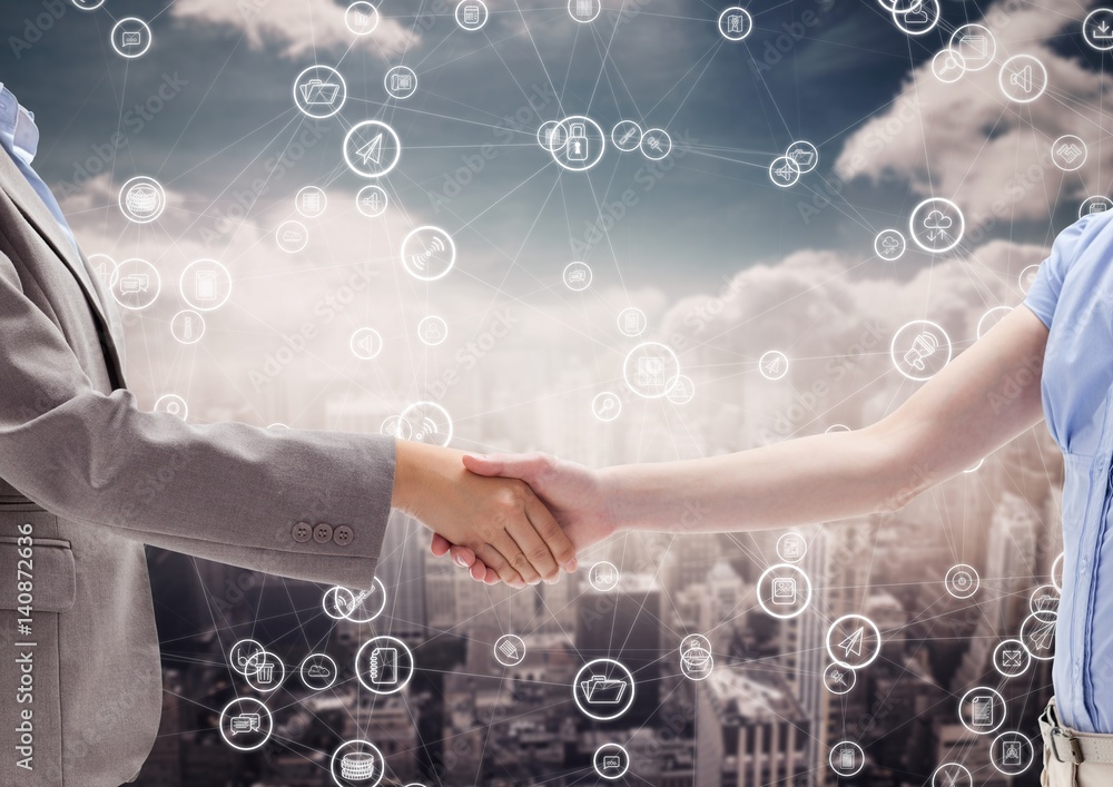 Mid section of businesspeople shaking hands Mid section of businesspeople shaking hands