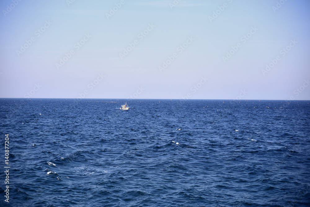 A boat in the middle of the sea