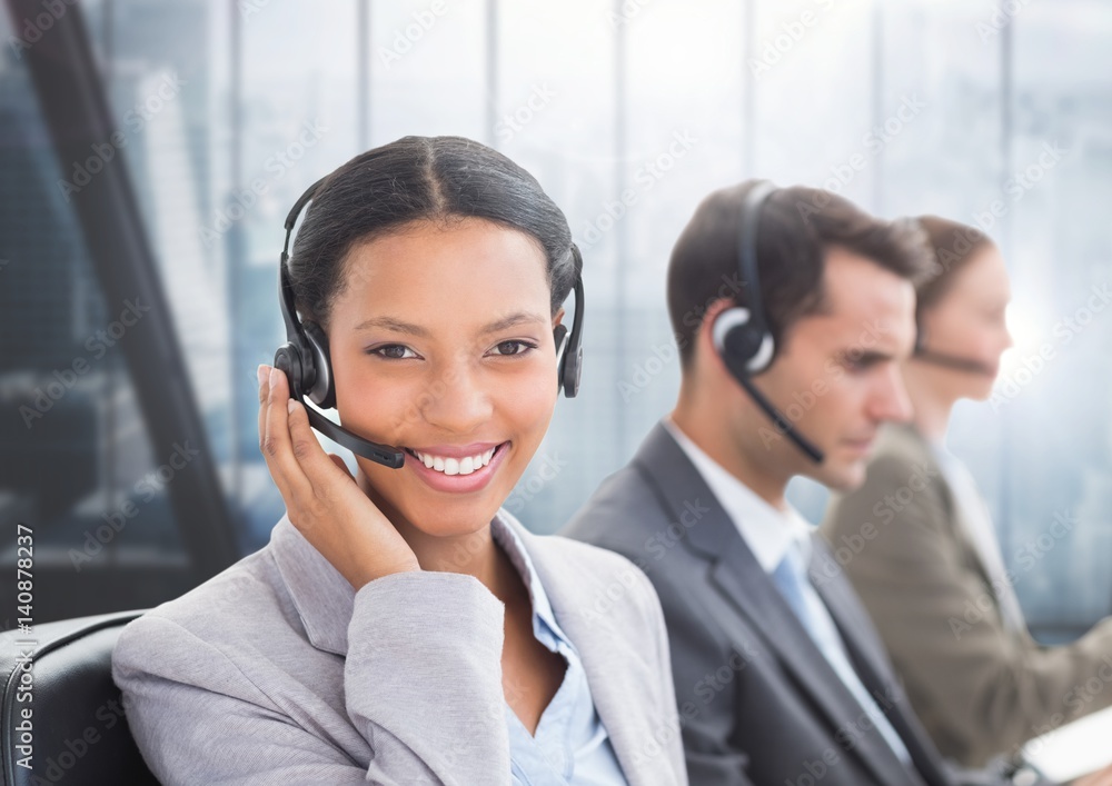 Portrait of smiling customer service woman talking on headset Portrait of smiling customer service woman talking on headset