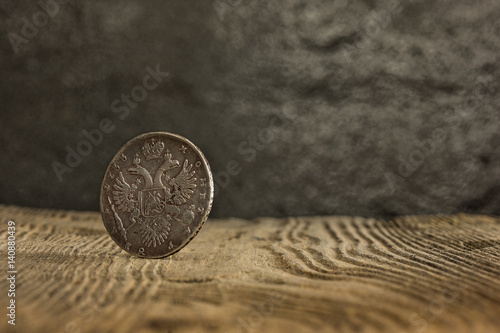 Closeup of old russian coin on a wooden background.