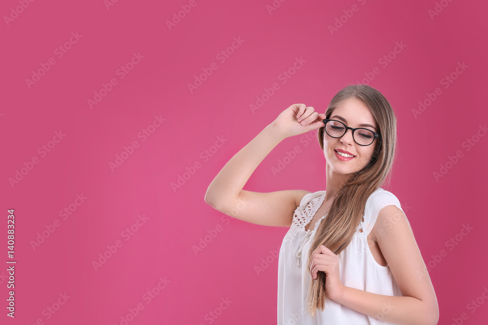Young beautiful stylish woman on color background Young beautiful stylish woman on color background