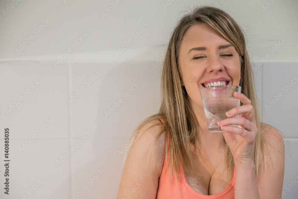 Healthy Lifestyle. Portrait Of Happy Smiling Young Woman With Glass Of Fresh Water. Healthcare. Drinks. Health, Beauty, Diet Concept. Healthy Eating. Healthy Lifestyle. Portrait Of Happy Smiling Young Woman With Glass Of Fresh Water. Healthcare. Drinks. Health, Beauty, Diet Concept. Healthy Eating.