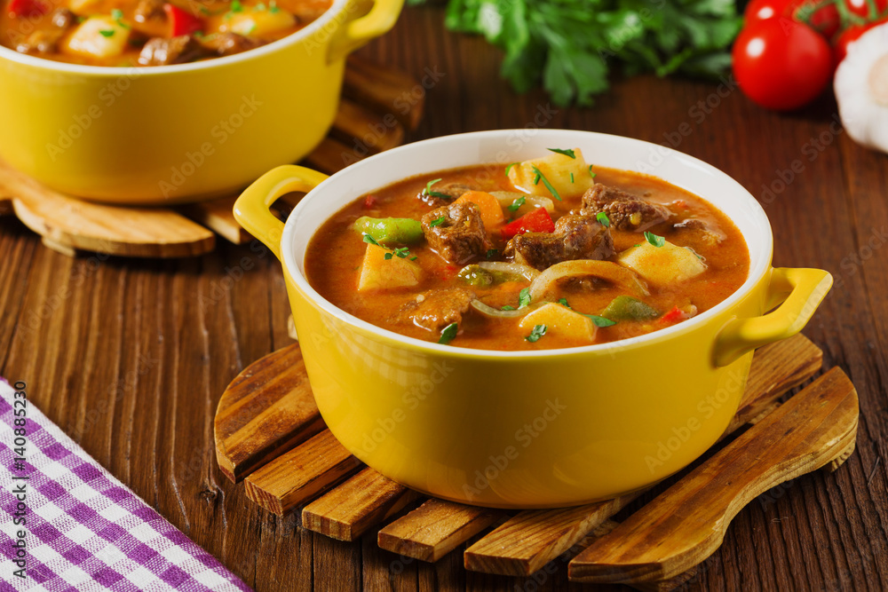 Beef stew served with cooked potatoes. Beef stew served with cooked potatoes.