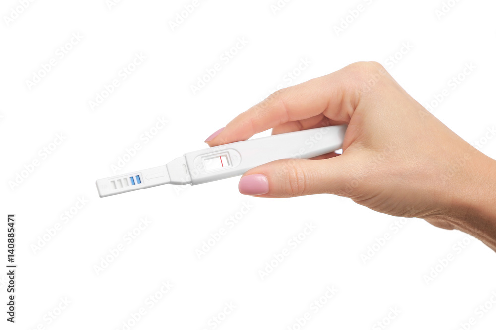 Pregnancy test in hand on white background Pregnancy test in hand on white background