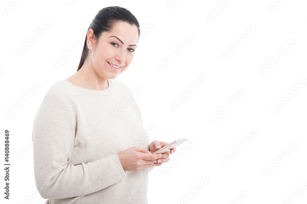Beautiful young woman texting on her cellphone Beautiful young woman texting on her cellphone