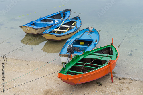 colorful fishing boats on the shore