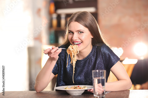 Beautiful woman eating past...