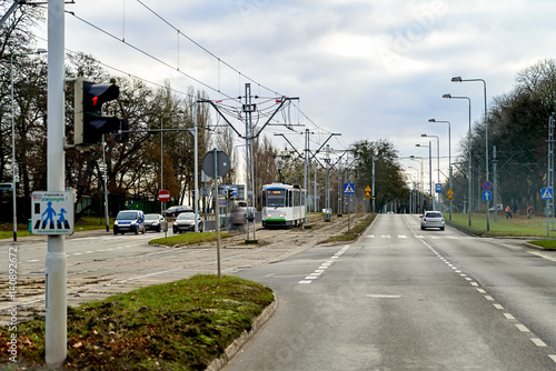The tram goes along the street