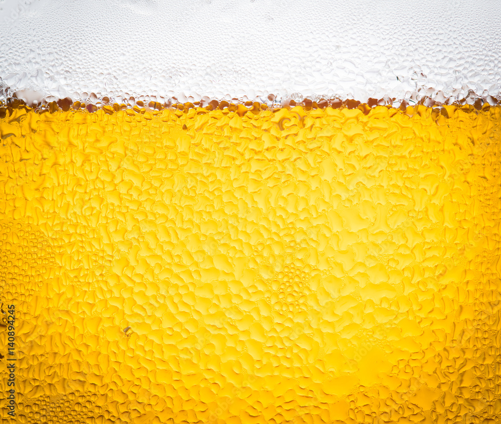 background beer and bubbles with condensation droplets on the outside of the glass background beer and bubbles with condensation droplets on the outside of the glass