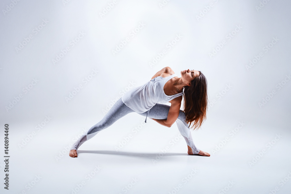 Woman doing yoga isolated on white background Woman doing yoga isolated on white background