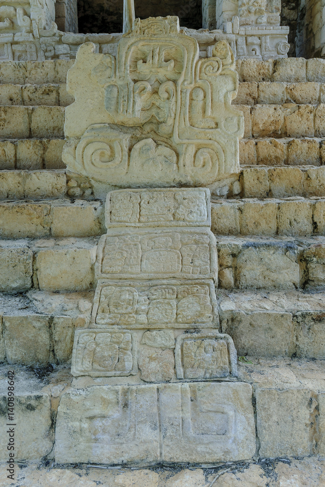 stela with bas-reliefs in the acropolis of the Mayan archaeological enclosure of Ek Balam in Yucatan, mexico