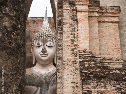 Ruin ancient Buddhist temple, Wat Si Chum Sukhothai, landmark in Thailand