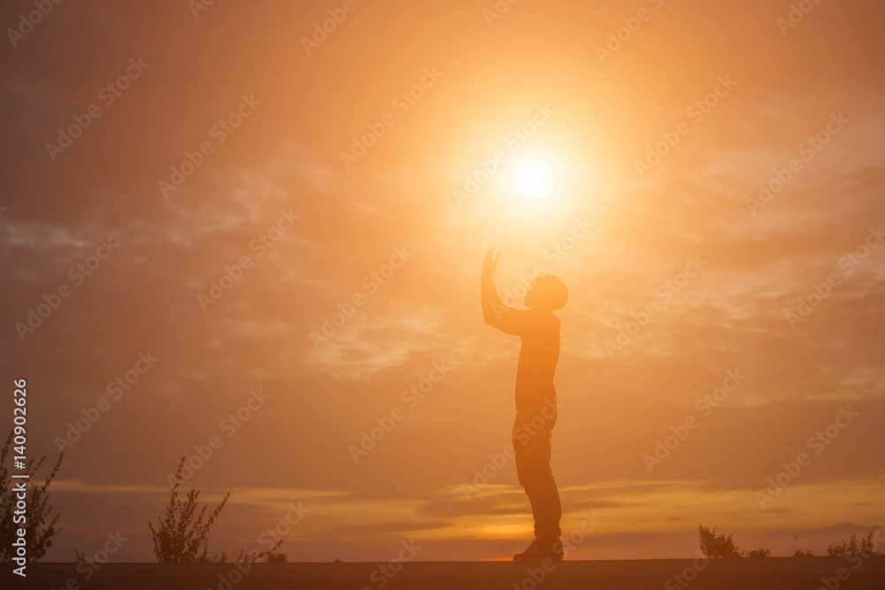 Man show hands silhouette sunset background  