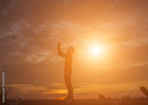Man show hands silhouette sunset background 