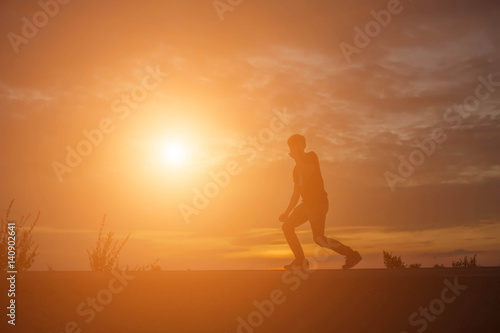 Man show hands silhouette sunset background  
