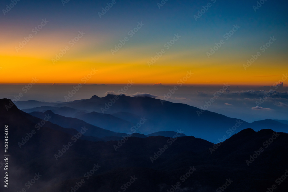 Amazing sunrise view from Adam's Peak, or Sri Pada, sacred buddhist place. Mountains of Sri Lanka. Amazing sunrise view from Adam's Peak, or Sri Pada, sacred buddhist place. Mountains of Sri Lanka.