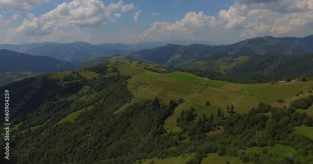 Flying in the Carpathians mountains above the pine forest Flying in the Carpathians mountains above the pine forest