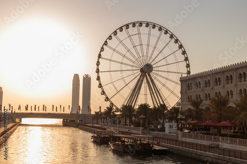 SHARJAH, UAE - OCTOBER 28: Ferris wheel in Al Qasba. Sharjah - third largest and most populous city in United Arab Emirates, on October 28, 2013.