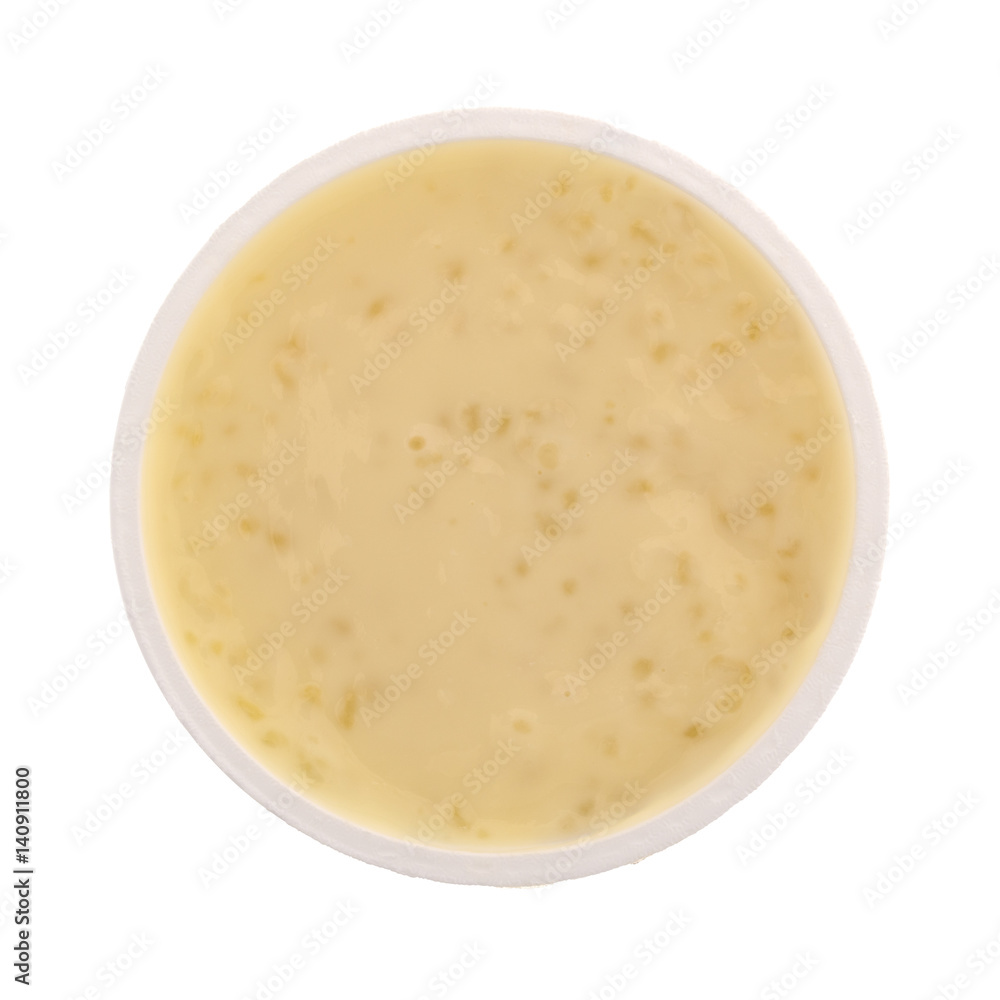 Top view of tapioca pudding in an opened container isolated on a white background. Top view of tapioca pudding in an opened container isolated on a white background.